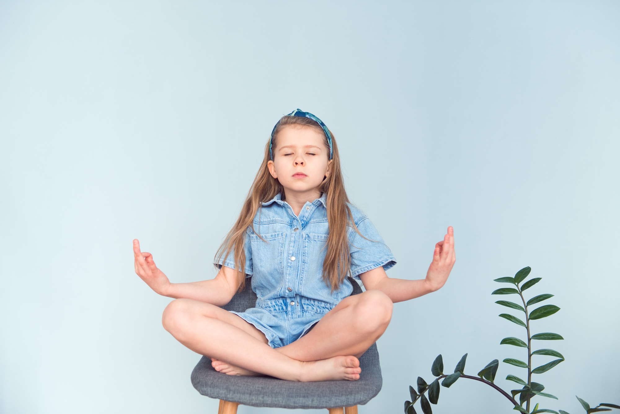 Cute girl meditating zen pose