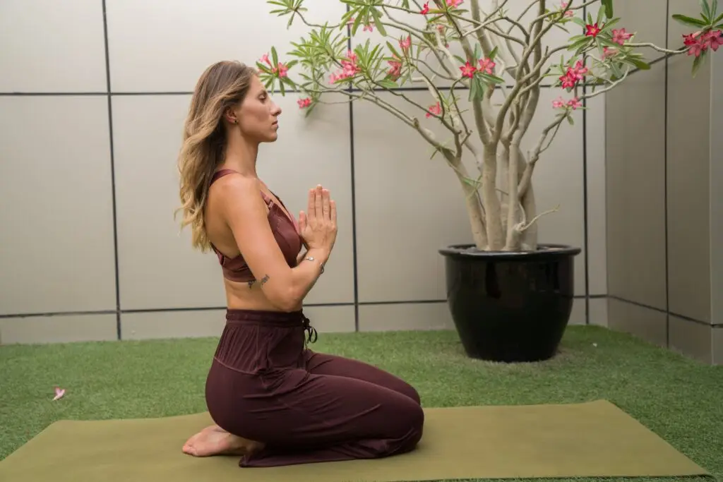 Woman meditating in the zen garden